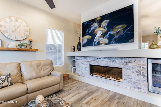 4422 E Spur Dr, Cave Creek, AZ 85331 - living room with wine cooler, wood finished floors, and a fireplace