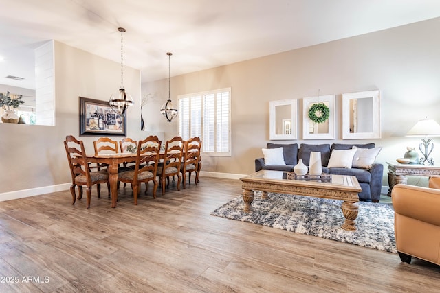 4422 E Spur Dr, Cave Creek, AZ 85331 - living area with baseboards, a chandelier, and wood finished floors