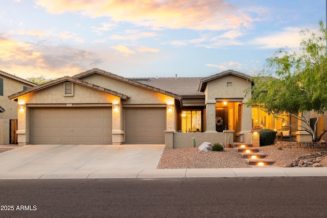 4422 E Spur Dr, Cave Creek, AZ 85331 - view of front of home featuring stucco siding, an attached garage, driveway, and a tiled roof