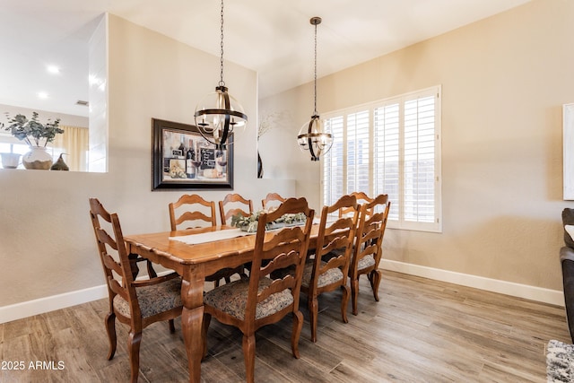 4422 E Spur Dr, Cave Creek, AZ 85331 - dining area with a chandelier, wood finished floors, and baseboards