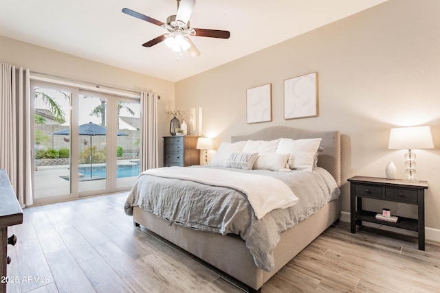 4422 E Spur Dr, Cave Creek, AZ 85331 - bedroom featuring access to outside, light wood-type flooring, ceiling fan, and baseboards
