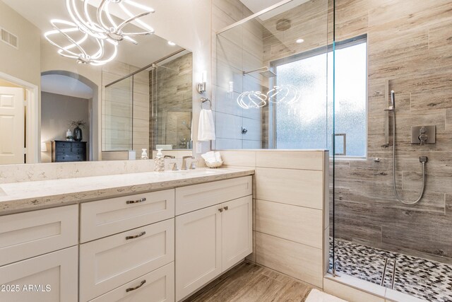 4422 E Spur Dr, Cave Creek, AZ 85331 - bathroom with a chandelier, a stall shower, vanity, and wood finished floors