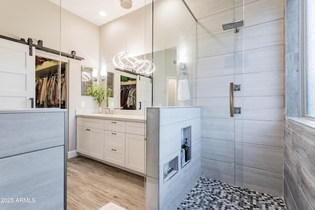 4422 E Spur Dr, Cave Creek, AZ 85331 - full bathroom featuring a shower stall, vanity, a spacious closet, and wood finished floors