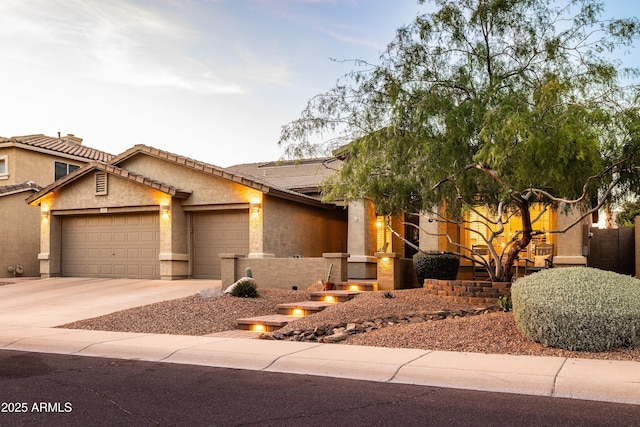 4422 E Spur Dr, Cave Creek, AZ 85331 - view of front facade with a garage, concrete driveway, stucco siding, and a tile roof