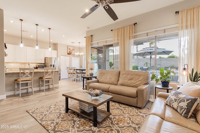 4422 E Spur Dr, Cave Creek, AZ 85331 - living area with a chandelier, light wood finished floors, a ceiling fan, and recessed lighting