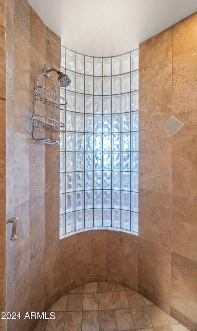 bathroom with a tile shower