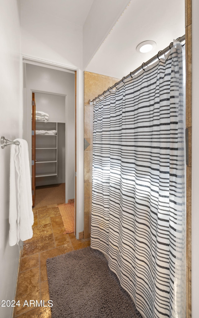 bathroom featuring curtained shower