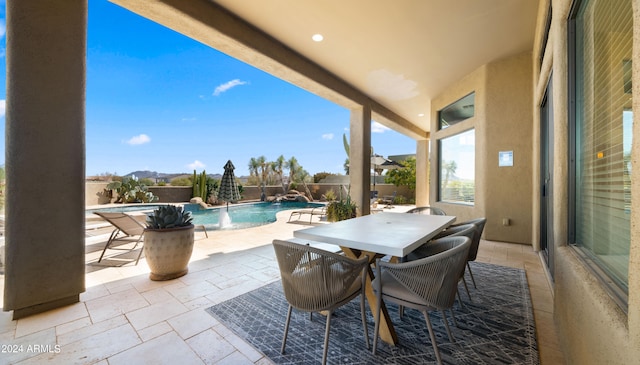 view of patio / terrace with pool water feature and a fenced in pool