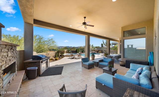 view of patio / terrace featuring an outdoor living space with a fireplace, a fenced in pool, ceiling fan, and a grill