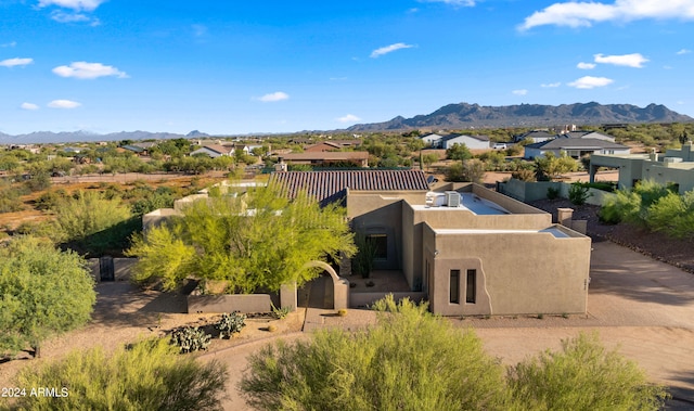 drone / aerial view featuring a mountain view