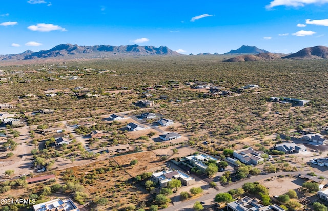 birds eye view of property featuring a mountain view