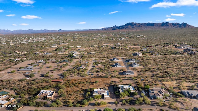 birds eye view of property with a mountain view