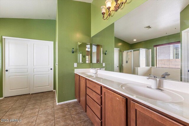 45131 W Horse Mesa Rd, Maricopa, AZ 85139 - full bathroom with a shower stall, double vanity, a chandelier, and tile patterned floors