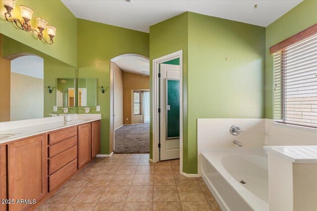 45131 W Horse Mesa Rd, Maricopa, AZ 85139 - bathroom featuring a bath, double vanity, and tile patterned floors