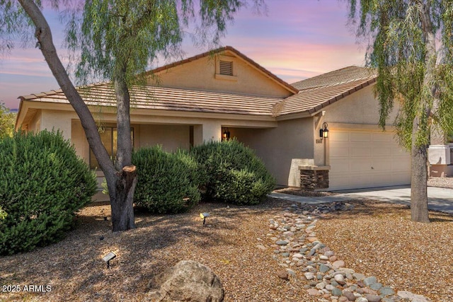 45131 W Horse Mesa Rd, Maricopa, AZ 85139 - view of front of property with a garage, stucco siding, a tiled roof, and concrete driveway