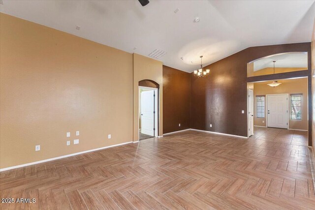 45131 W Horse Mesa Rd, Maricopa, AZ 85139 - spare room with arched walkways, lofted ceiling, and a chandelier