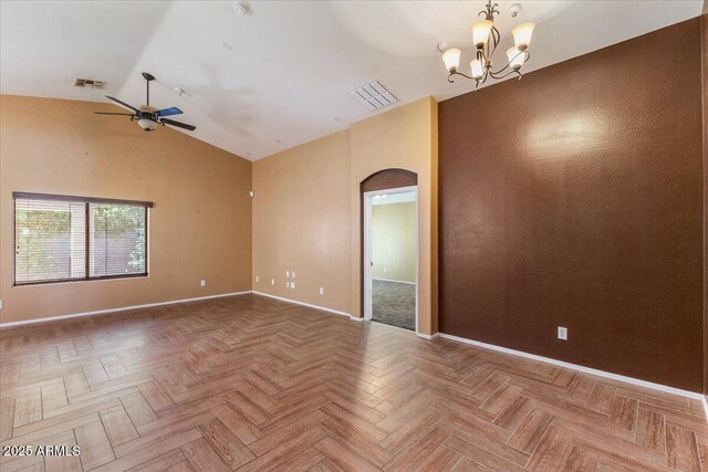 45131 W Horse Mesa Rd, Maricopa, AZ 85139 - spare room with lofted ceiling, a ceiling fan, arched walkways, and a chandelier