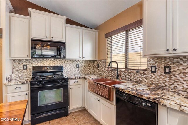45131 W Horse Mesa Rd, Maricopa, AZ 85139 - kitchen featuring black appliances, lofted ceiling, light stone countertops, white cabinetry, and light tile patterned floors