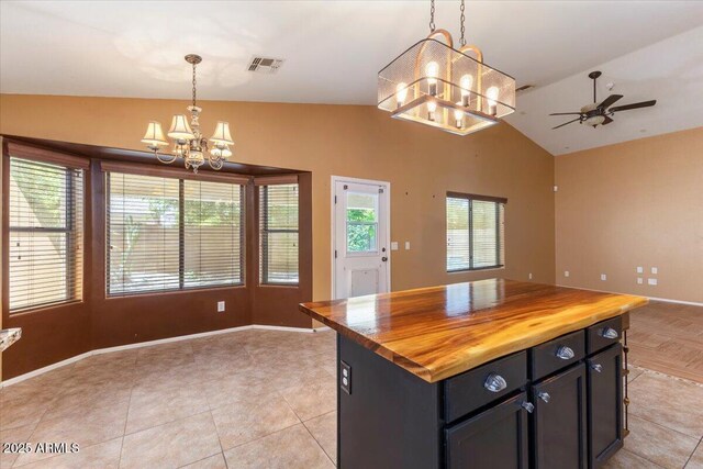 45131 W Horse Mesa Rd, Maricopa, AZ 85139 - kitchen featuring a chandelier, vaulted ceiling, open floor plan, wood counters, and decorative light fixtures