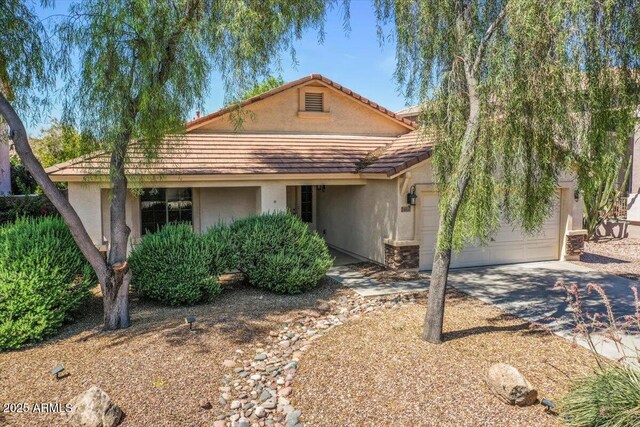 45131 W Horse Mesa Rd, Maricopa, AZ 85139 - view of front of home featuring stucco siding, an attached garage, driveway, and a tile roof