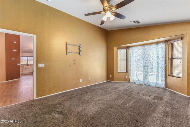 45131 W Horse Mesa Rd, Maricopa, AZ 85139 - empty room featuring plenty of natural light, carpet, and ceiling fan