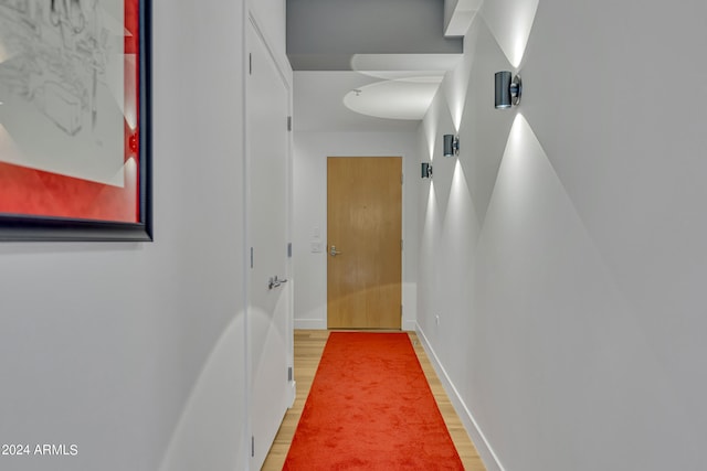 corridor featuring hardwood / wood-style flooring