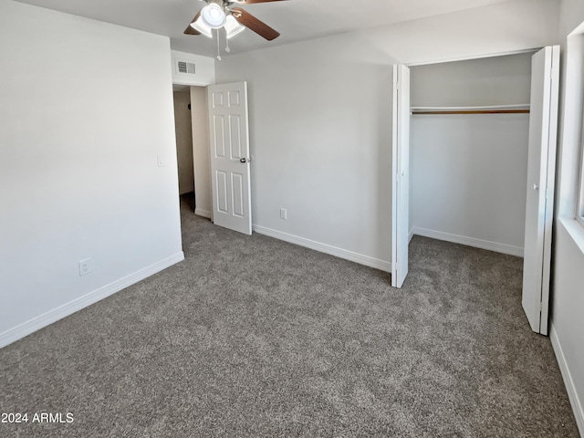 unfurnished bedroom featuring ceiling fan, a closet, and carpet floors