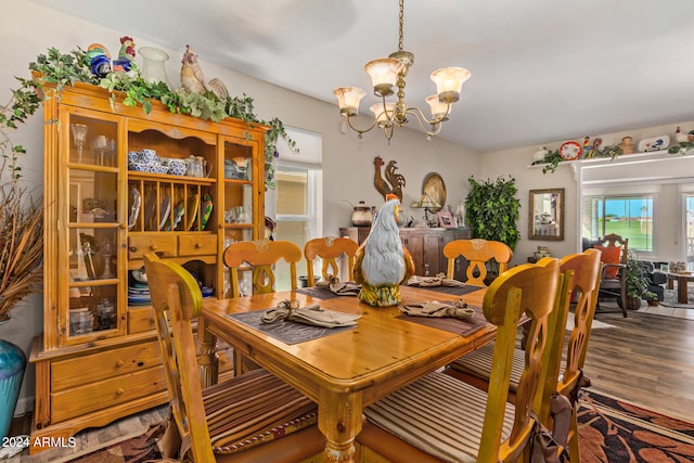 dining room with a chandelier and hardwood / wood-style floors