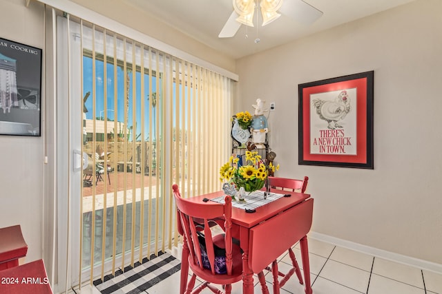 tiled dining area with ceiling fan