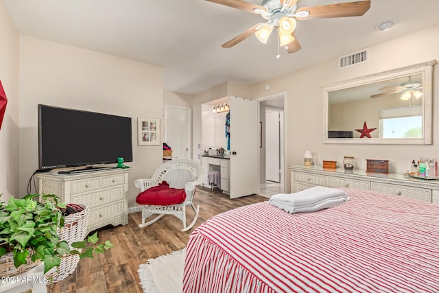 bedroom with wood-type flooring and ceiling fan