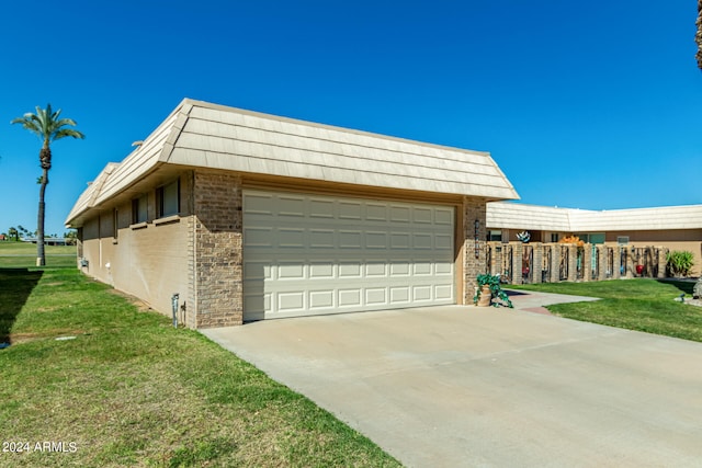 view of home's exterior featuring a yard and a garage