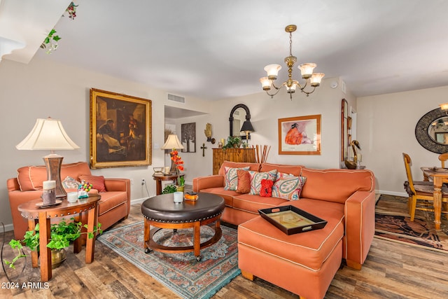 living room featuring a notable chandelier and hardwood / wood-style floors