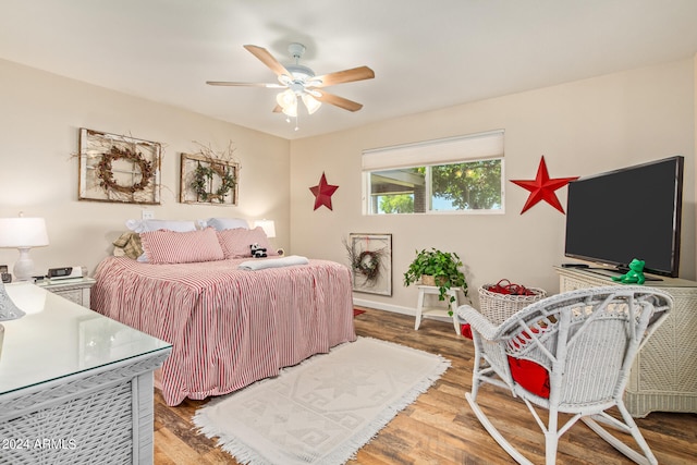 bedroom with wood-type flooring and ceiling fan