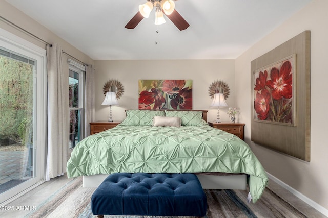 bedroom with baseboards, access to exterior, and a ceiling fan