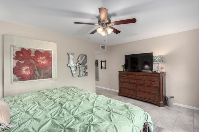 tiled bedroom with visible vents, baseboards, and ceiling fan