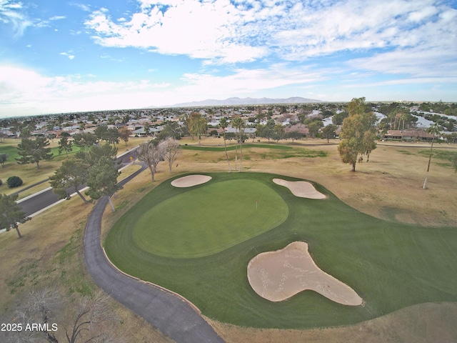 birds eye view of property featuring golf course view and a mountain view