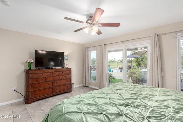 bedroom with light tile patterned floors, a ceiling fan, baseboards, and access to outside