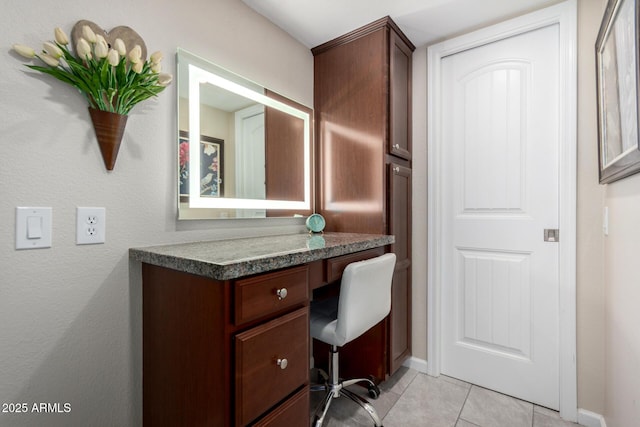 bathroom with tile patterned floors and vanity