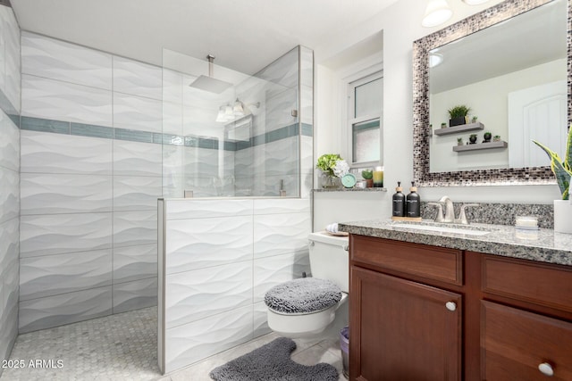 full bathroom with vanity, toilet, and a walk in shower