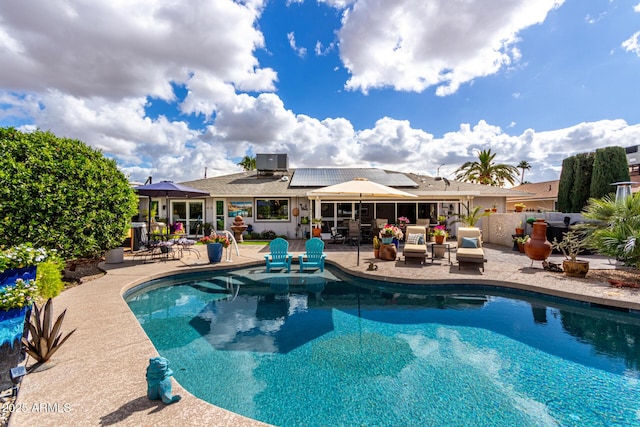 view of swimming pool with a fenced in pool and a patio area