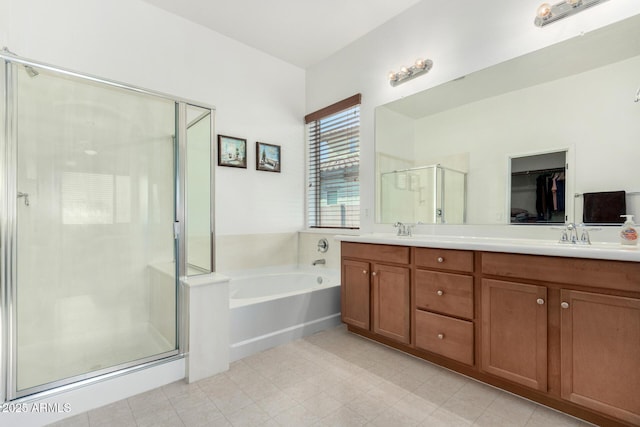 bathroom featuring vanity and plus walk in shower