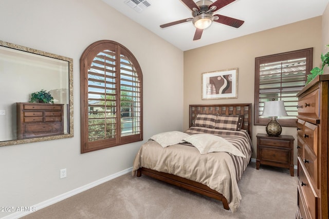 bedroom featuring ceiling fan and light carpet