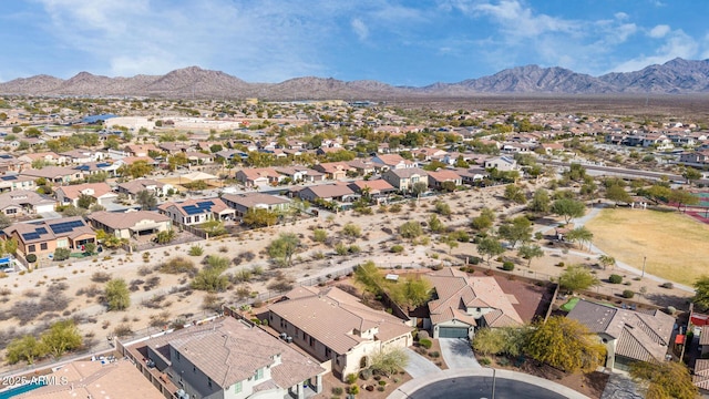 birds eye view of property with a mountain view