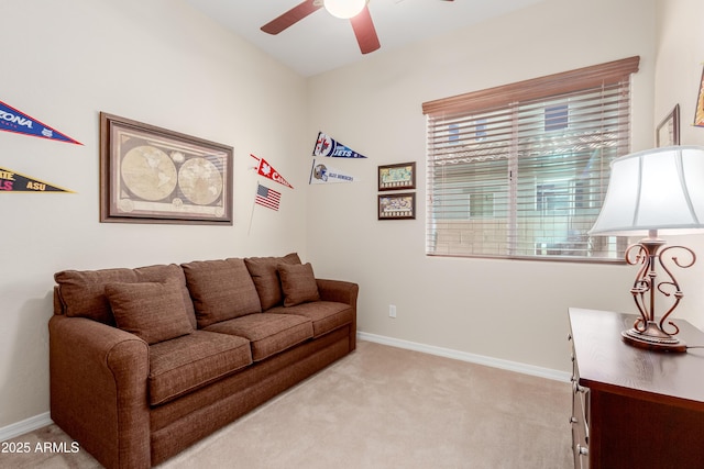 living room with ceiling fan and light carpet