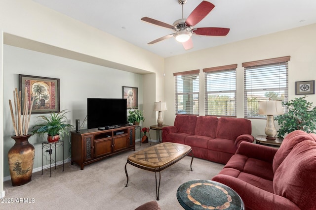 living room with light carpet and ceiling fan