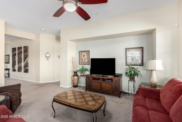 carpeted living room with ceiling fan