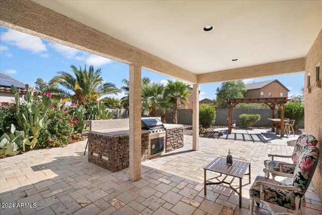 view of patio / terrace featuring a pergola and area for grilling