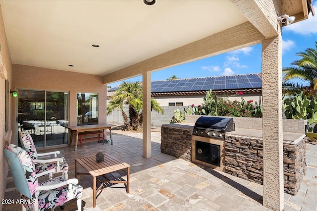 view of patio / terrace featuring area for grilling and an outdoor kitchen