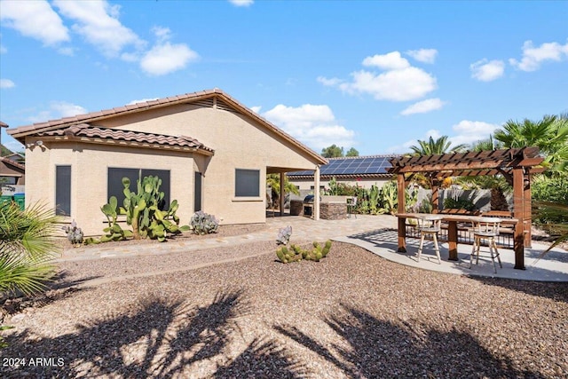 exterior space with a pergola and a patio area