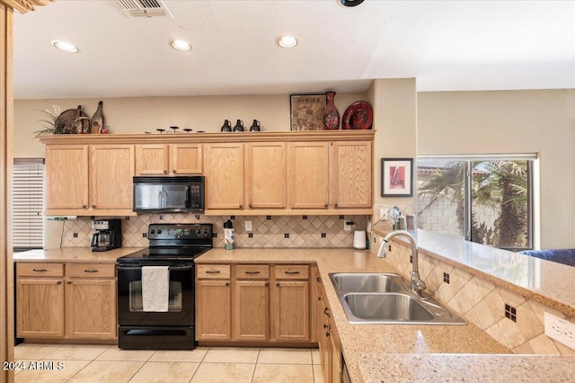 kitchen featuring sink, backsplash, black appliances, light brown cabinets, and light tile patterned floors